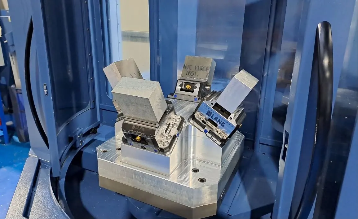Aluminium parts clamped in 5-axis workholding inside a CNC machine in Chatteris, Cambridgeshire